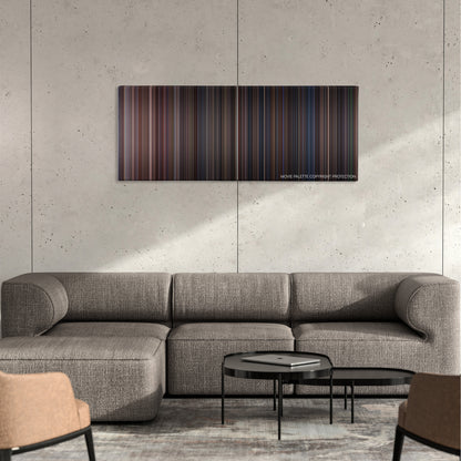Under Siege color palette canvas on a concrete wall above a gray sectional sofa