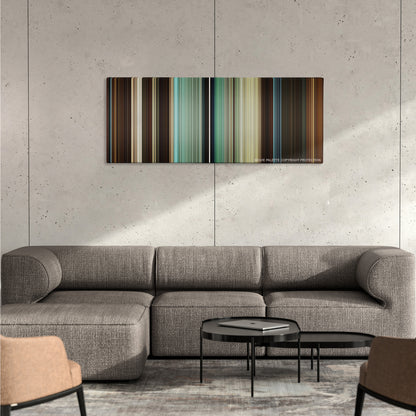 Hercules color palette canvas on a concrete wall above a gray sectional sofa