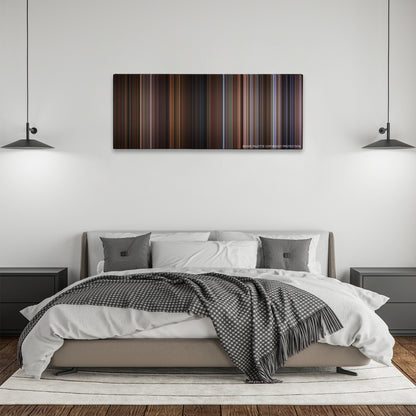 Wild Wild West color palette canvas above a bed, between two black pendant lamps