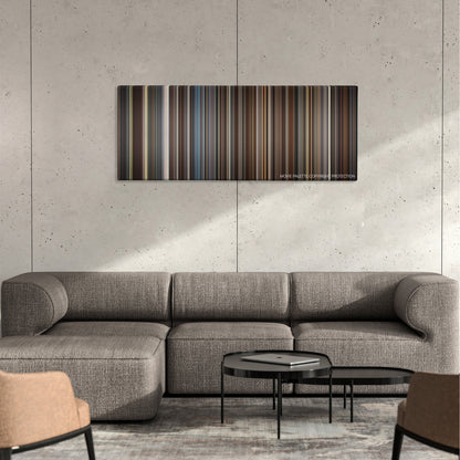 Trumbo color palette canvas on a concrete wall above a gray sectional sofa