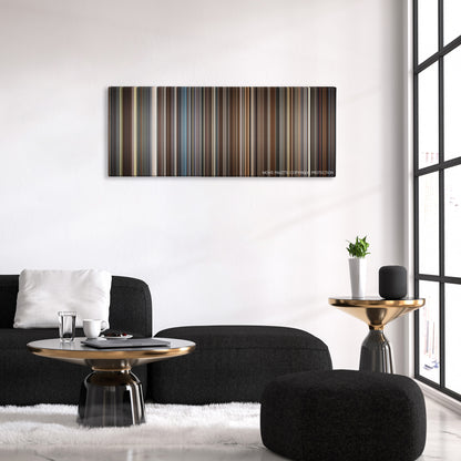 Trumbo color palette canvas above a black sofa with a gold-topped table