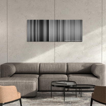 Ikiru color palette canvas on a concrete wall above a gray sectional sofa