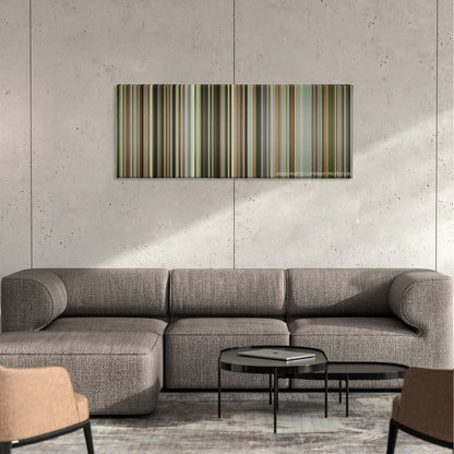Capernaum color palette canvas on a concrete wall above a gray sectional sofa