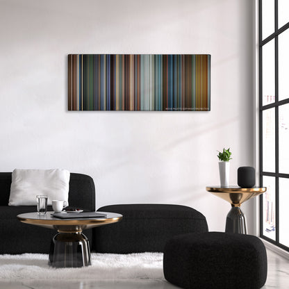 Mission: Impossible III color palette canvas above a black sofa with a gold-topped table
