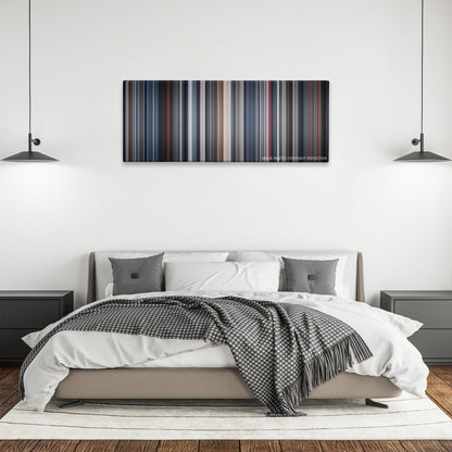I Am Mother color palette canvas above a bed, between two black pendant lamps
