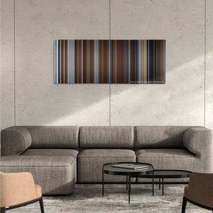 Molly's Game color palette canvas on a concrete wall above a gray sectional sofa