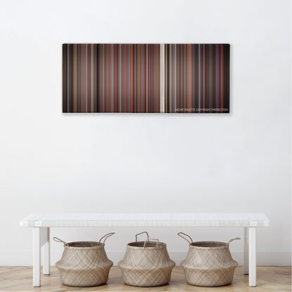 Empire Records color palette canvas above a white bench with three woven baskets