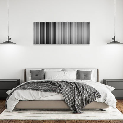 Ikiru color palette canvas above a bed, between two black pendant lamps
