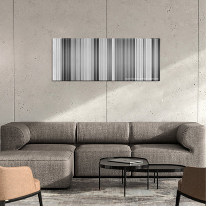 Nights of Cabiria color palette canvas on a concrete wall above a gray sectional sofa