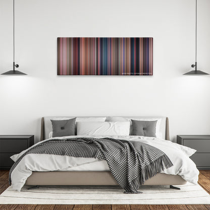 Heathers color palette canvas above a bed, between two black pendant lamps