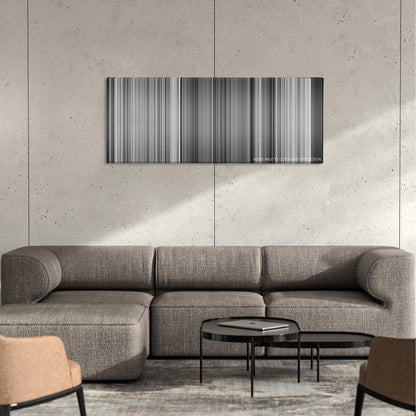 Sherlock Jr. color palette canvas on a concrete wall above a gray sectional sofa
