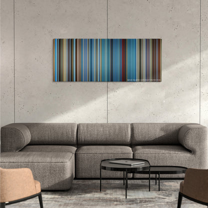 I Am Sam color palette canvas on a concrete wall above a gray sectional sofa