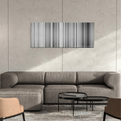 High and Low color palette canvas on a concrete wall above a gray sectional sofa