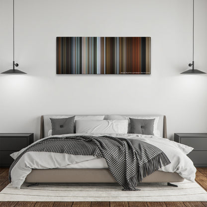 The Drop color palette canvas above a bed, between two black pendant lamps