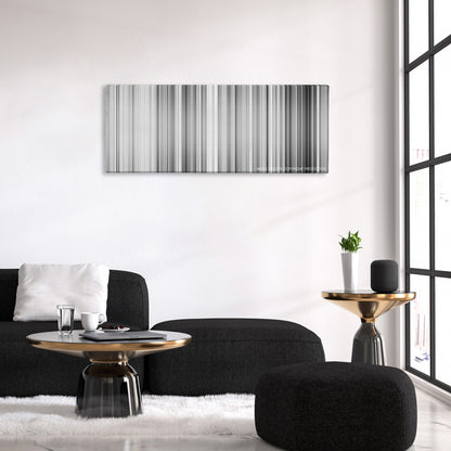 High and Low color palette canvas above a black sofa with a gold-topped table