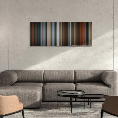 The Drop color palette canvas on a concrete wall above a gray sectional sofa