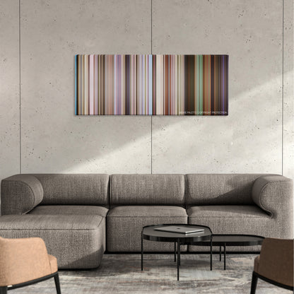 Raatchasan color palette canvas on a concrete wall above a gray sectional sofa