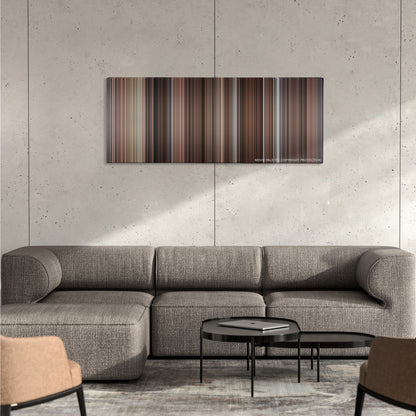 Four Weddings and a Funeral color palette canvas on a concrete wall above a gray sectional sofa