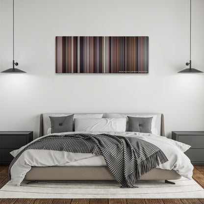Wall Street color palette canvas above a bed, between two black pendant lamps