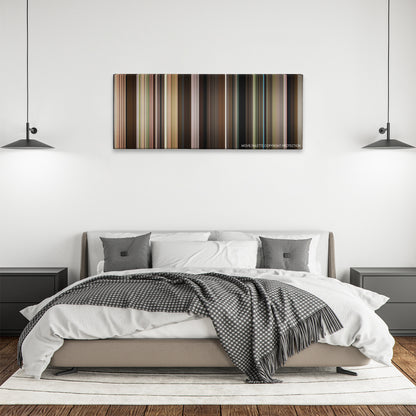 Sling Blade color palette canvas above a bed, between two black pendant lamps