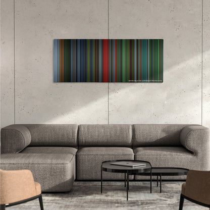 Saw IV color palette canvas on a concrete wall above a gray sectional sofa