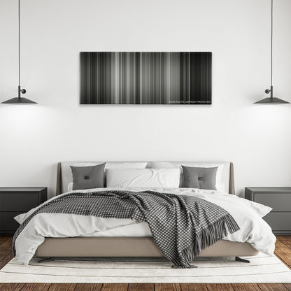 Sunrise color palette canvas above a bed, between two black pendant lamps