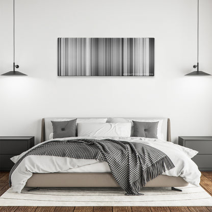 Sherlock Jr. color palette canvas above a bed, between two black pendant lamps