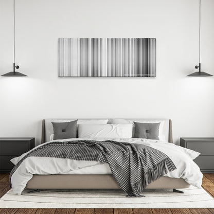 High and Low color palette canvas above a bed, between two black pendant lamps