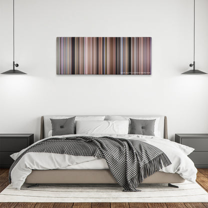Tommy Boy color palette canvas above a bed, between two black pendant lamps