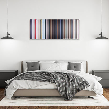 Superman color palette canvas above a bed, between two black pendant lamps