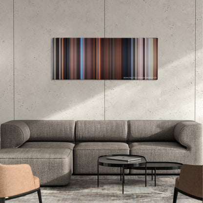 Far and Away color palette canvas on a concrete wall above a gray sectional sofa
