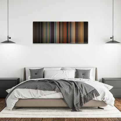 Rent color palette canvas above a bed, between two black pendant lamps