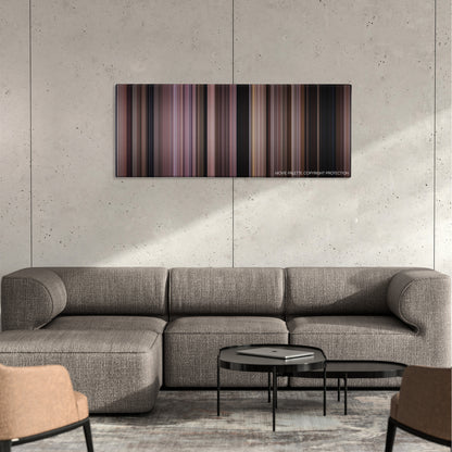 Uncle Buck color palette canvas on a concrete wall above a gray sectional sofa