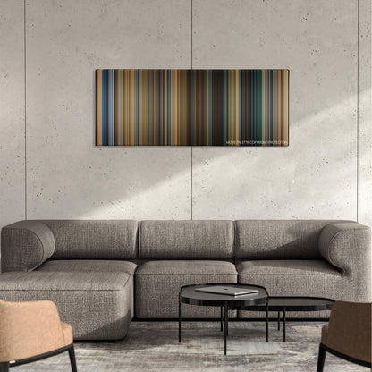 A Good Year color palette canvas on a concrete wall above a gray sectional sofa