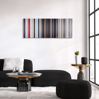 Superman color palette canvas above a black sofa with a gold-topped table