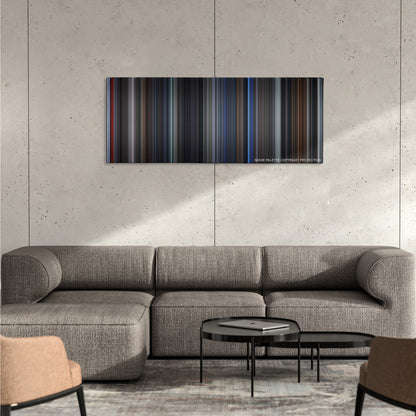 The Grudge color palette canvas on a concrete wall above a gray sectional sofa