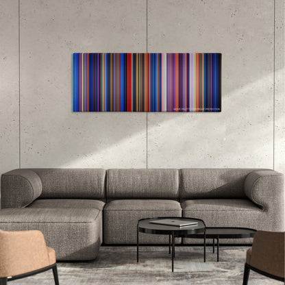 Fantasia color palette canvas on a concrete wall above a gray sectional sofa