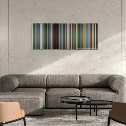 Snowden color palette canvas on a concrete wall above a gray sectional sofa