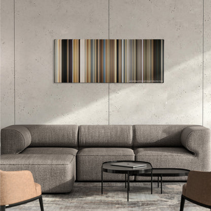 Dear John color palette canvas on a concrete wall above a gray sectional sofa