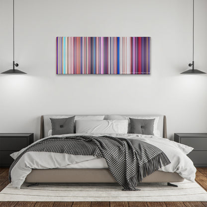 Sing color palette canvas above a bed, between two black pendant lamps
