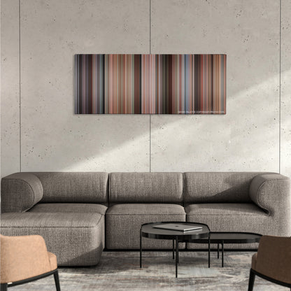 Kindergarten Cop color palette canvas on a concrete wall above a gray sectional sofa