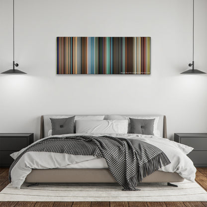 Pixels color palette canvas above a bed, between two black pendant lamps
