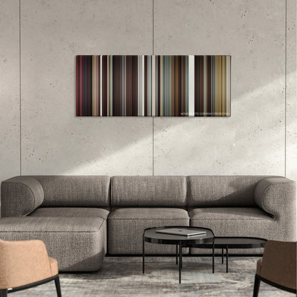 Something Borrowed color palette canvas on a concrete wall above a gray sectional sofa