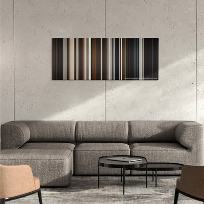 Dogville color palette canvas on a concrete wall above a gray sectional sofa