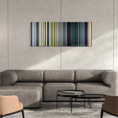 The Little Prince color palette canvas on a concrete wall above a gray sectional sofa