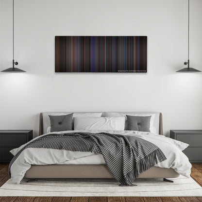 The Negotiator color palette canvas above a bed, between two black pendant lamps