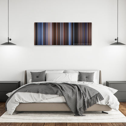 The Saint color palette canvas above a bed, between two black pendant lamps