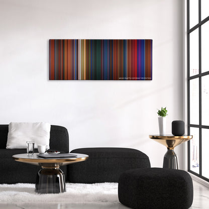 Peter Pan color palette canvas above a black sofa with a gold-topped table