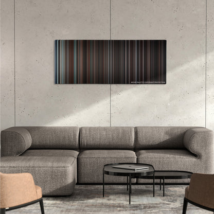 Devil color palette canvas on a concrete wall above a gray sectional sofa