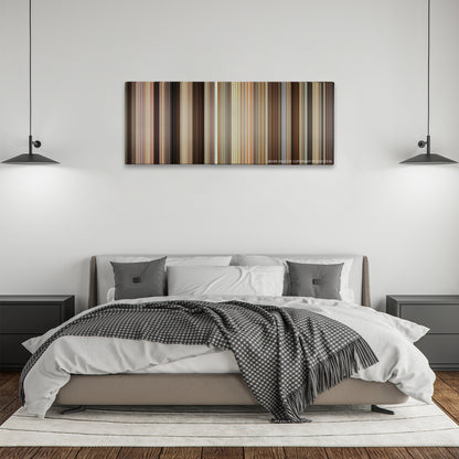 Trainwreck color palette canvas above a bed, between two black pendant lamps